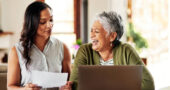 Cropped shot of a young attractive woman bonding with her grandmother before helping her with her finances in their home