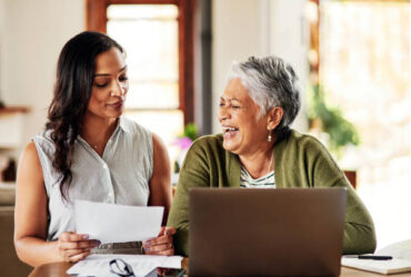 Cropped shot of a young attractive woman bonding with her grandmother before helping her with her finances in their home