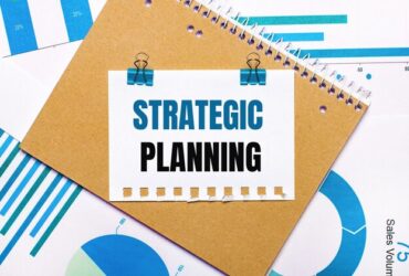 desktop-are-blue-light-blue-graphs-diagrams-brown-notebook-sheet-paper-with-blue-clips-strategic-planning-text-view-from-business-concept_380694-4782